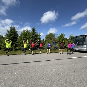 Got people to stretch along the drive.  Bus is electric